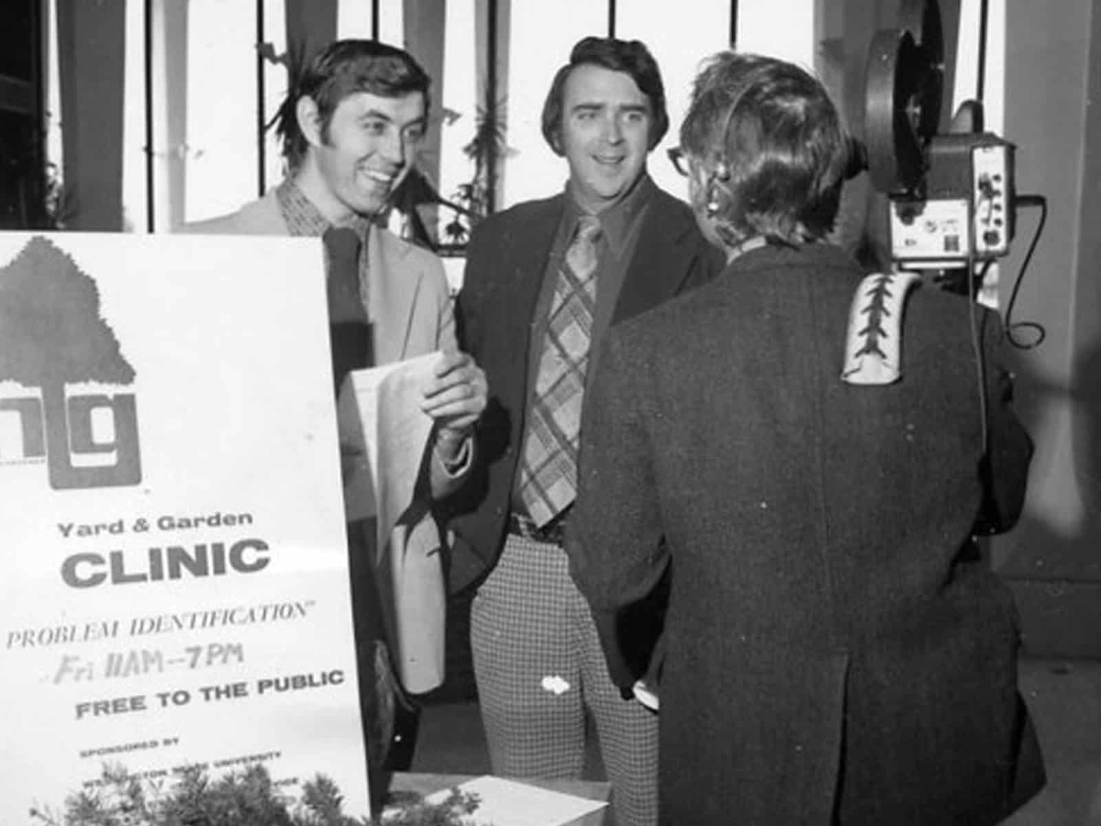 1973 photo of men answer reporters questions