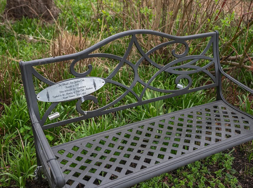 This bench donated by the Floral Arts Garden Club honors the service of past members. © Photographer: Nancy Crowell Photography