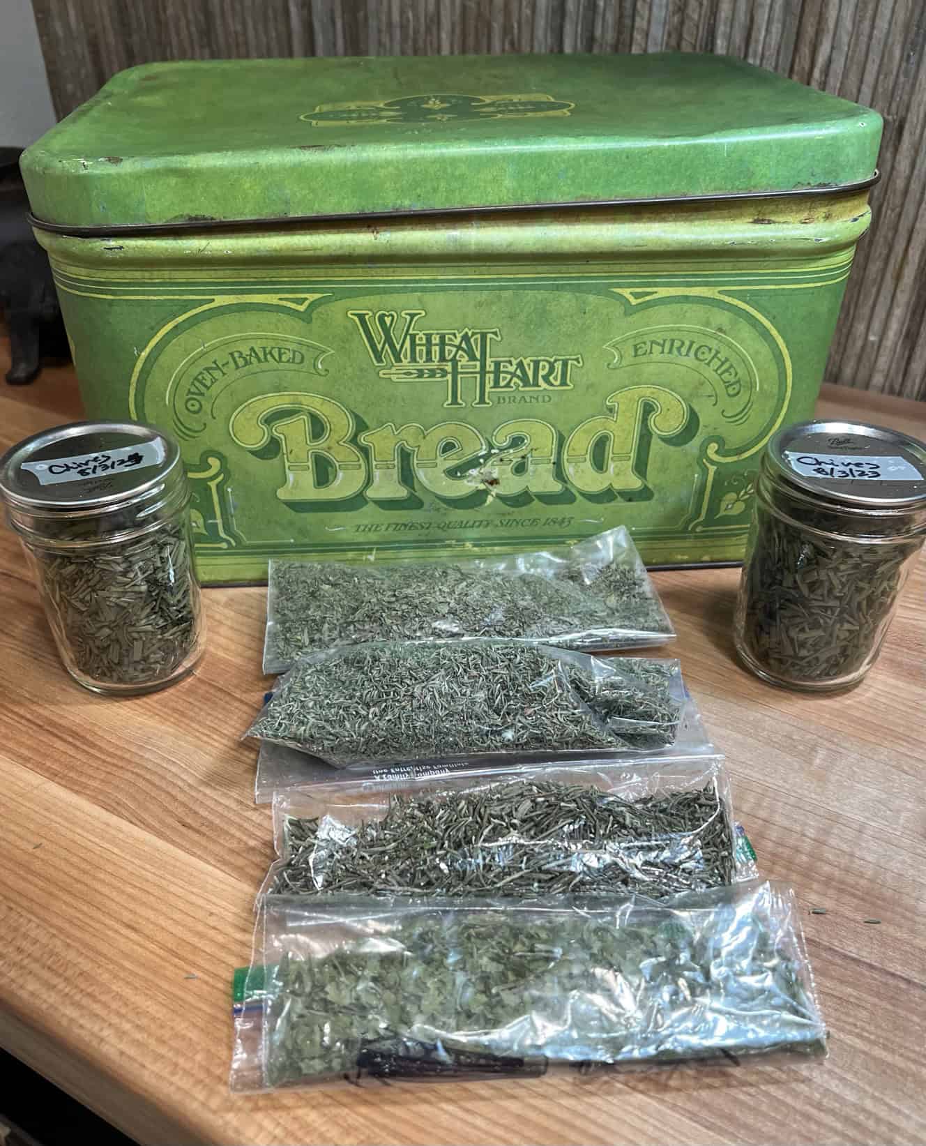 Air tight containers and light blocking storage bin for dried herbs. © Photographer: Laura Kuhn