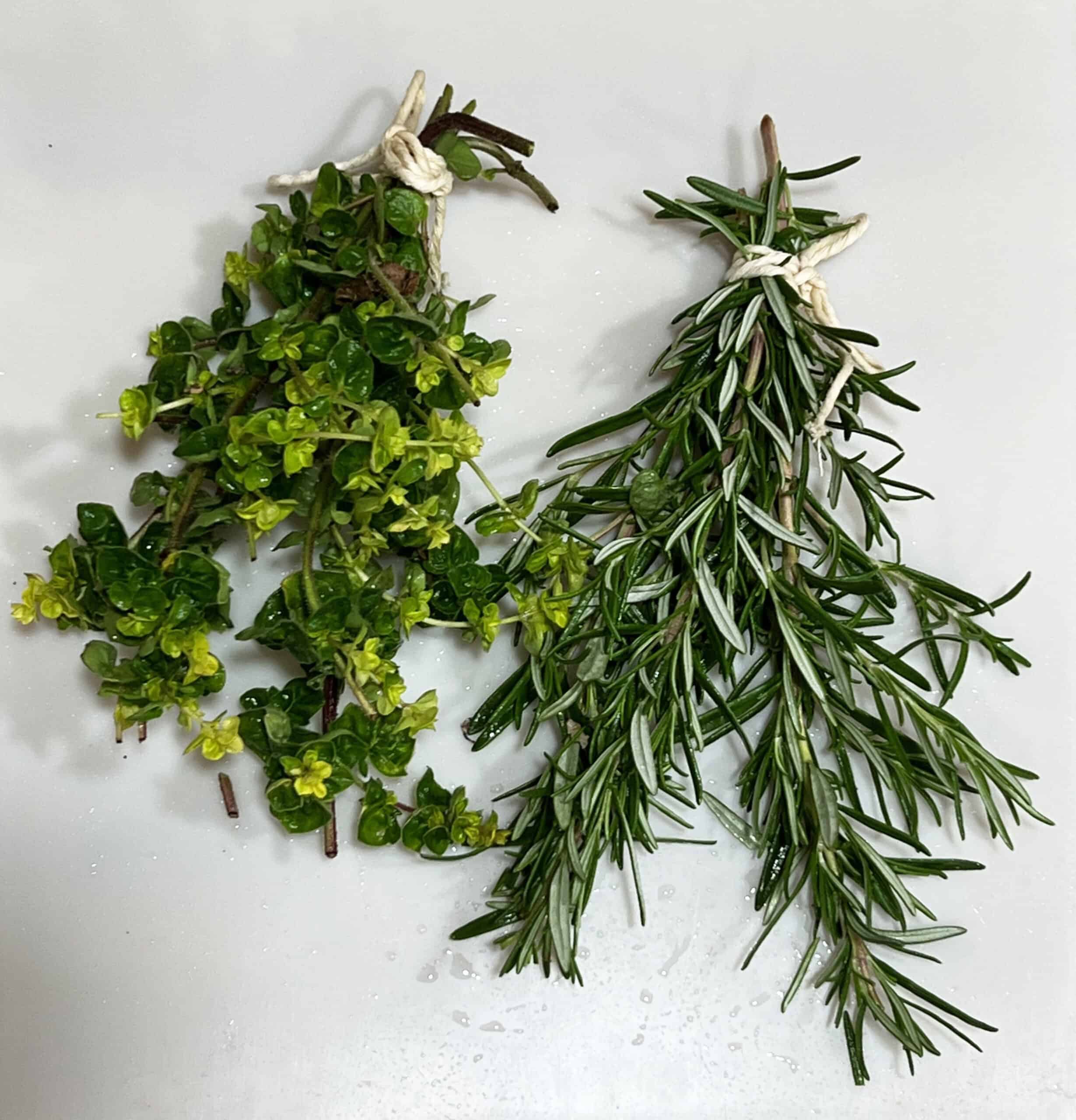 Bunches of herbs ready for hang drying. © Photographer: Laura Kuhn