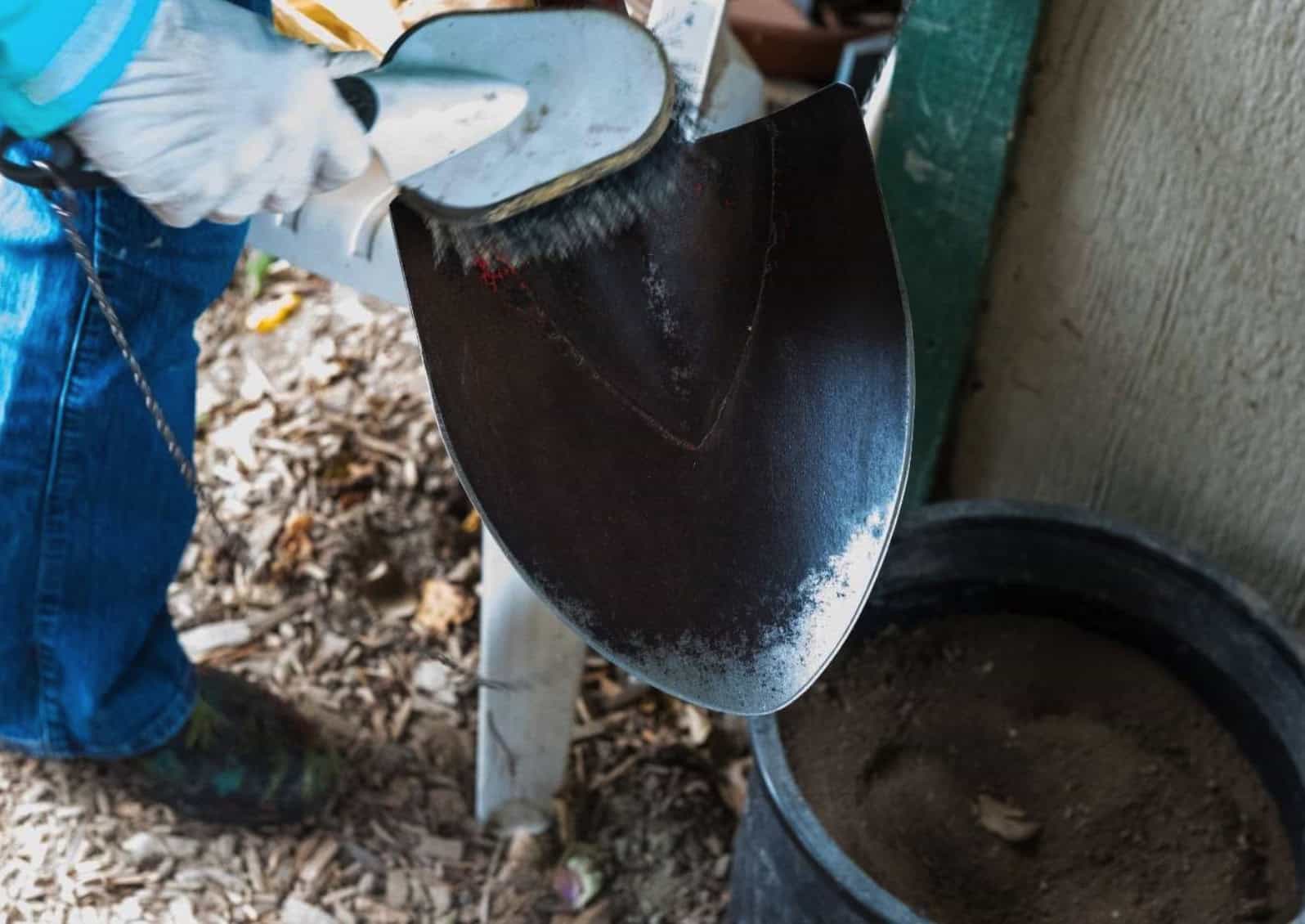 shovel with brush and sandy bucket