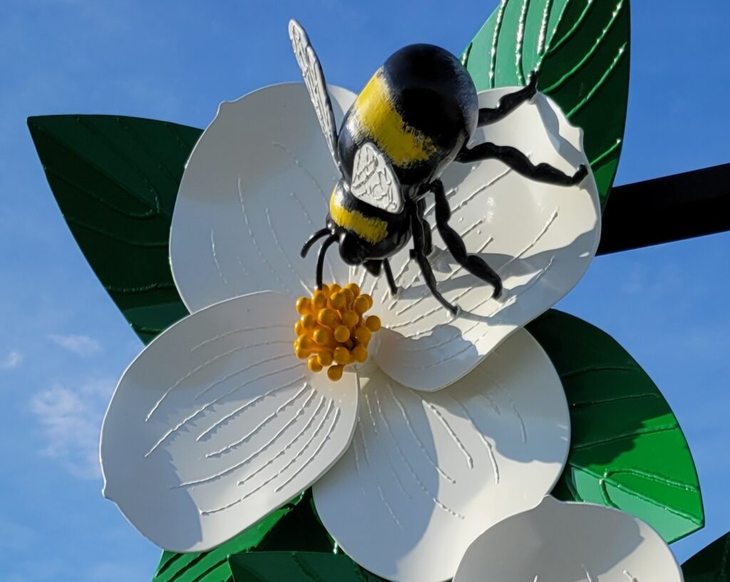 dogwood and bee sculpture