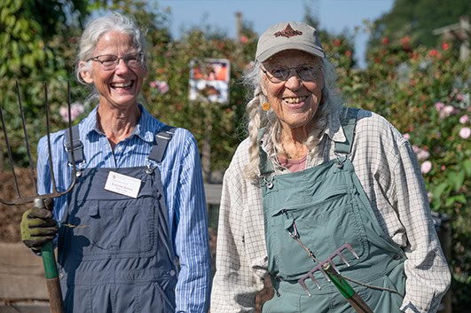 two women in overalls