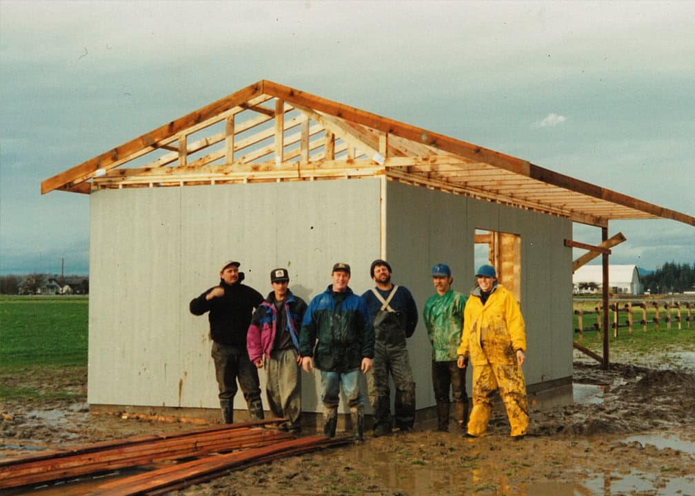 26_0619_pic4 workers standing in front of shed under construction