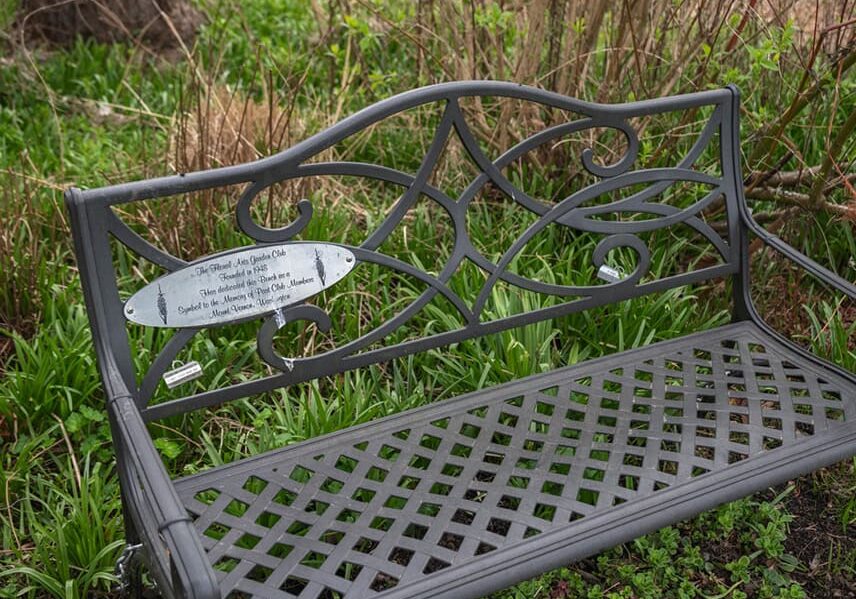 This bench donated by the Floral Arts Garden Club honors the service of past members. © Photographer: Nancy Crowell Photography