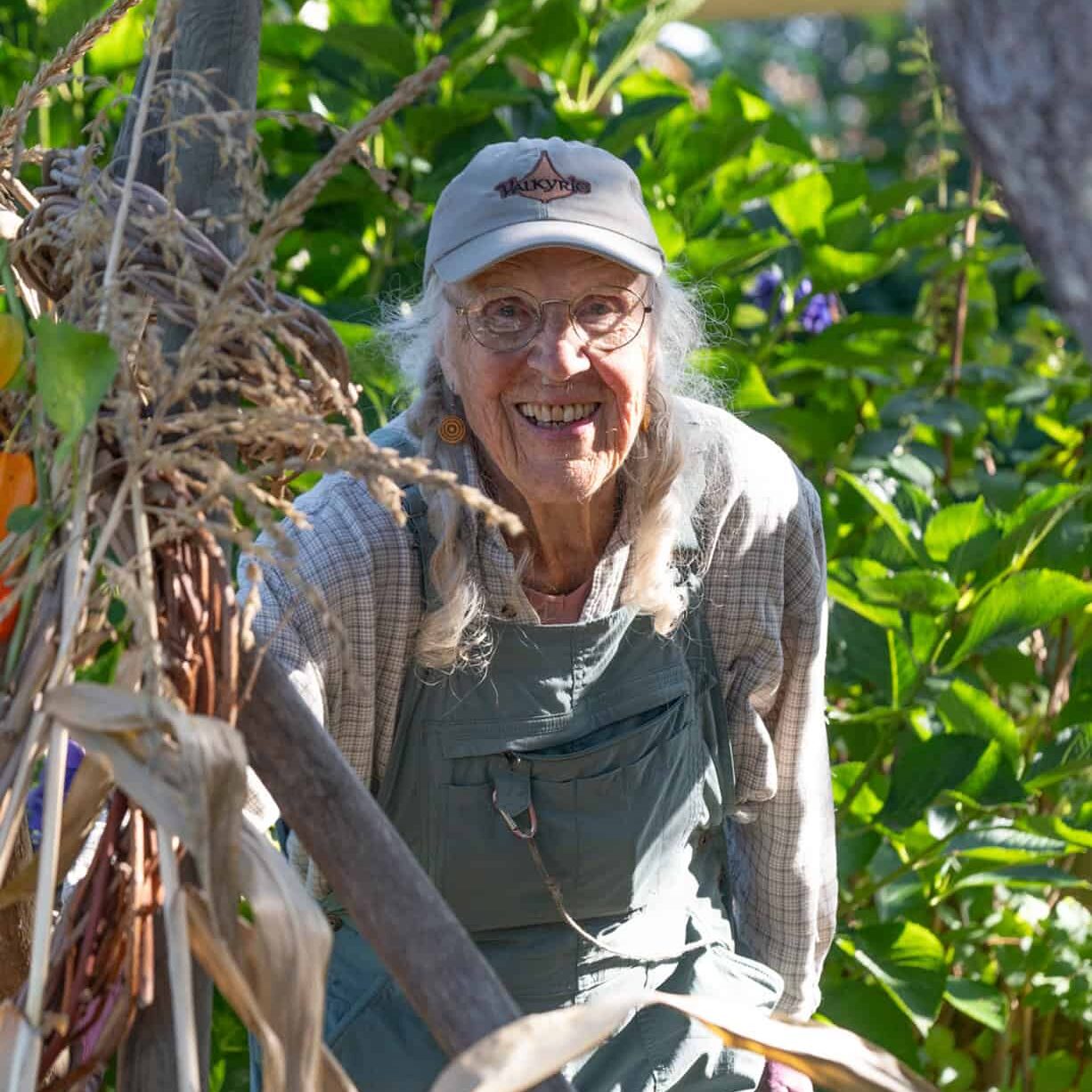 smiling woman in garden working