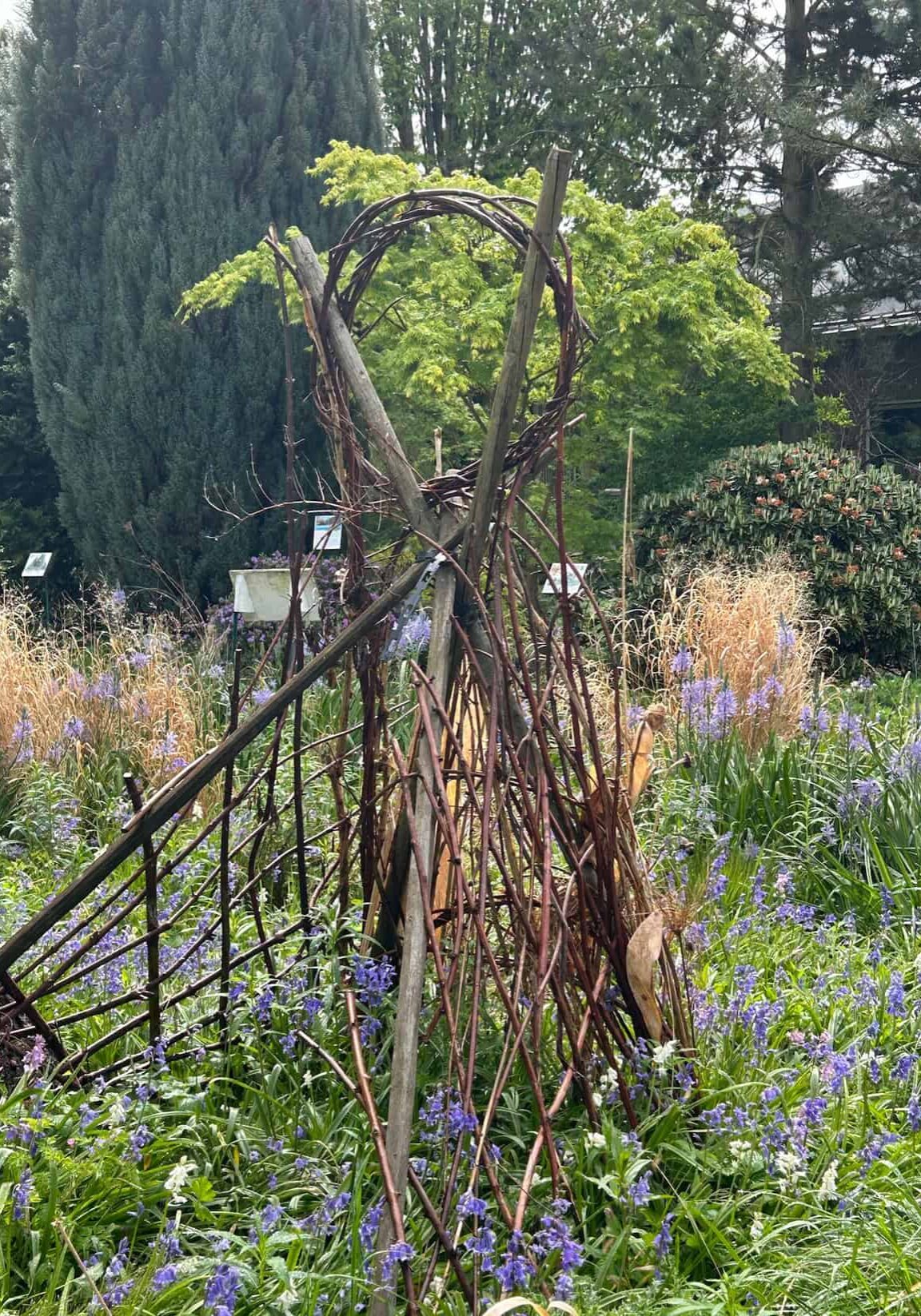 structure build of branches and twigs in garden
