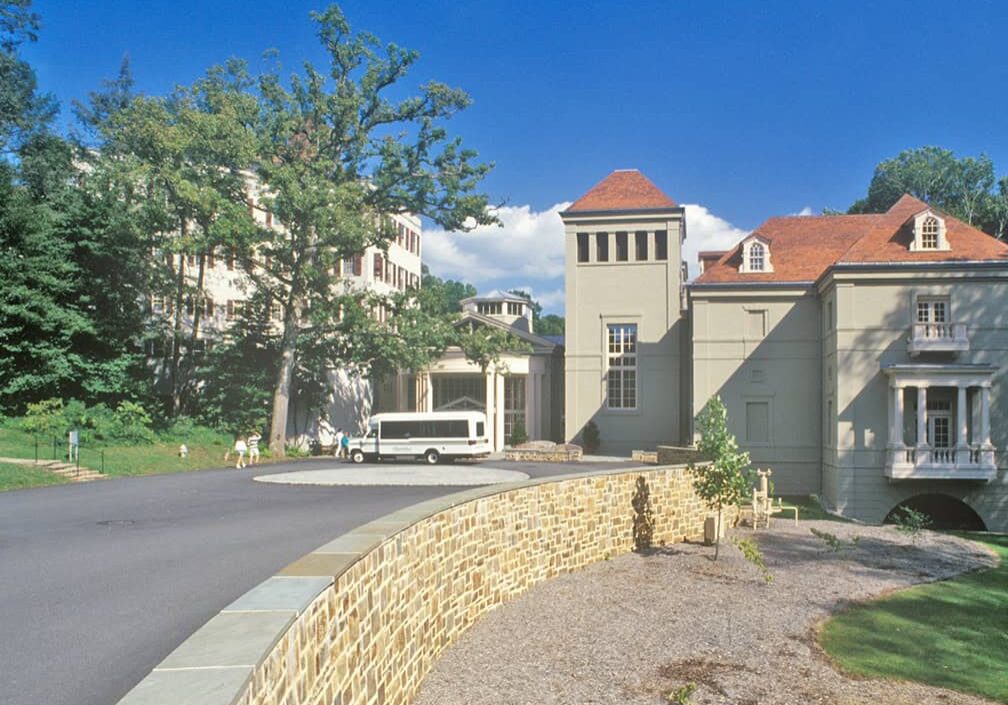 driveway with mansion in the distance