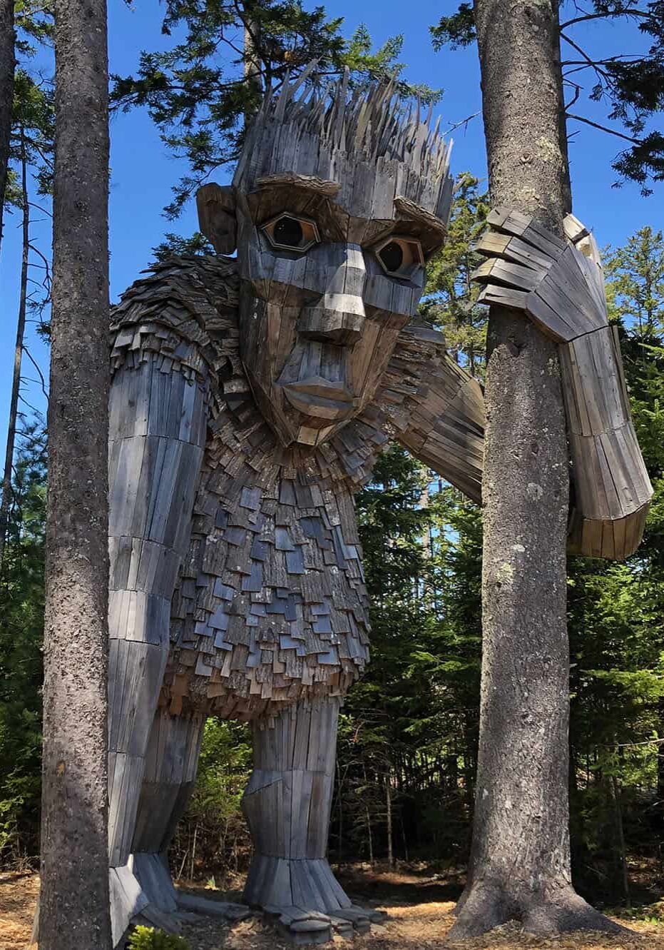 whimsical giant troll carved and built out of tree bark